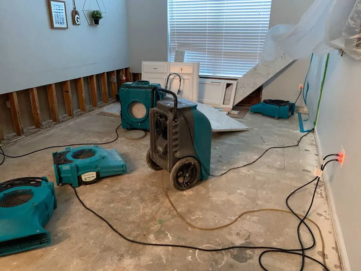 Dehumidifier in flood-cut room for Water Damage Restoration in Seven Oaks
